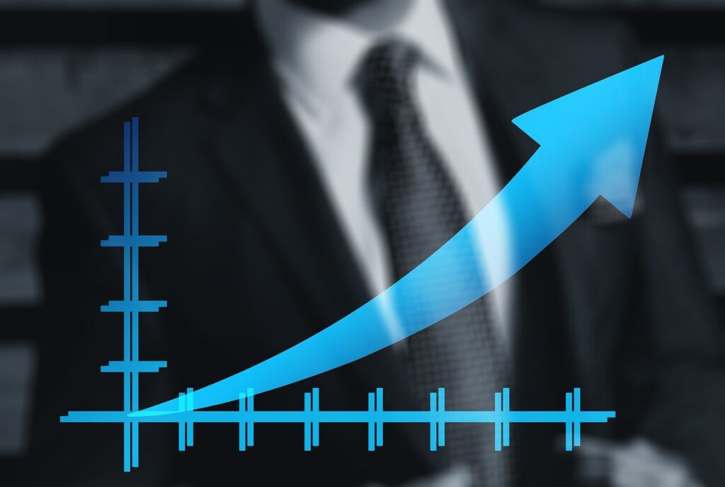 A blue upward-trending arrow on a graph overlays the image of a person in a suit, suggesting business growth or financial success, potentially reflecting strategies to manage NHS costs.